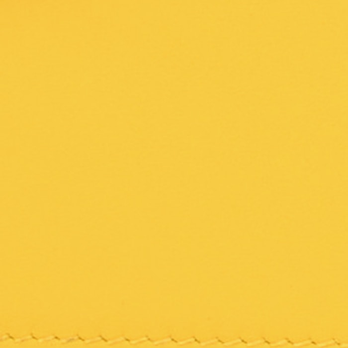 this is a close up swatch image by fashionphile of the hermes jaune de naples color on swift leather