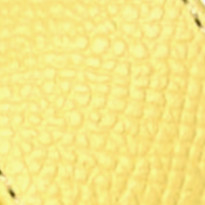 this is a close up swatch image by fashionphile of the hermes jaune curcuma color on epsom leather