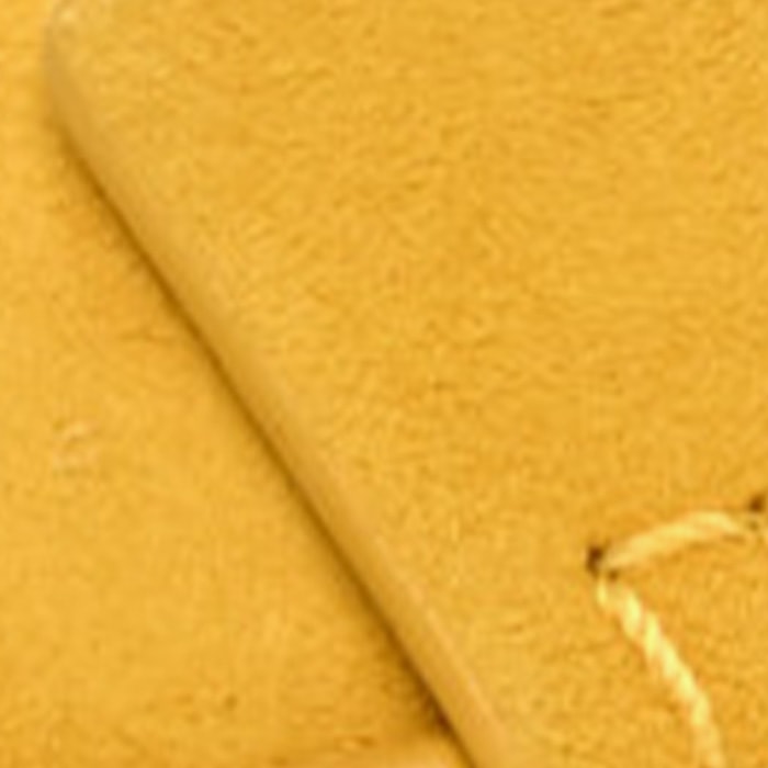 this is a close up swatch image by fashionphile of the hermes jaune citron color on suede leather