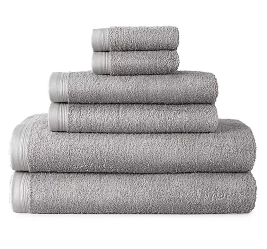 JCPenney Home Expressions Solid and Stripe Bath Towel Collection: 70% off + free shipping w/ $49