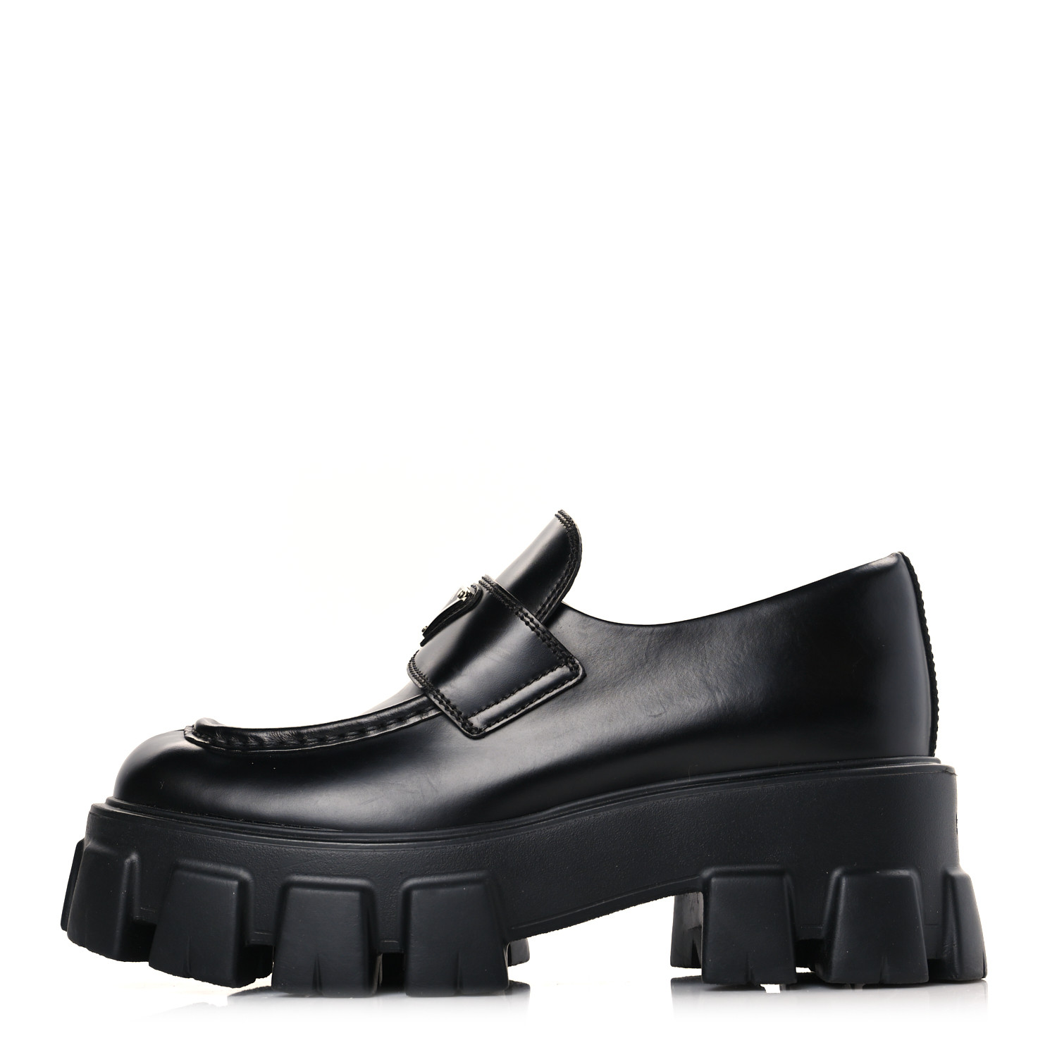 side view of PRADA Spazzolato Rois Metal Triangle Logo Monolith 55mm Loafers in the color Black by FASHIONPHILE