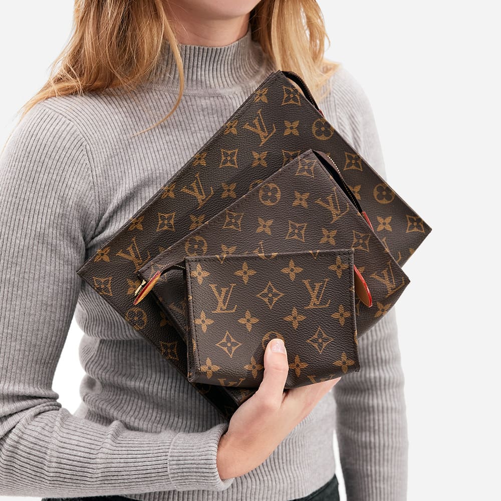 comparing the three sizes of louis vuitton toiletry pouches on figure by FASHIONPHILE
