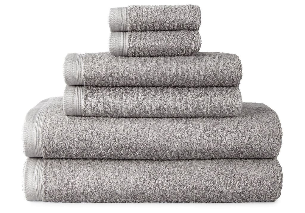 Home Expressions Solid and Stripe Towels From $5.60 + free shipping w/ $75
