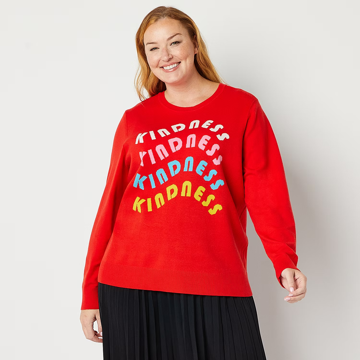 woman with red sweater bearing the word 'kindness'