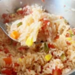 Make this easy Mexican rice during your next taco night! Combine rice with some Rotel, broth, and spices and you